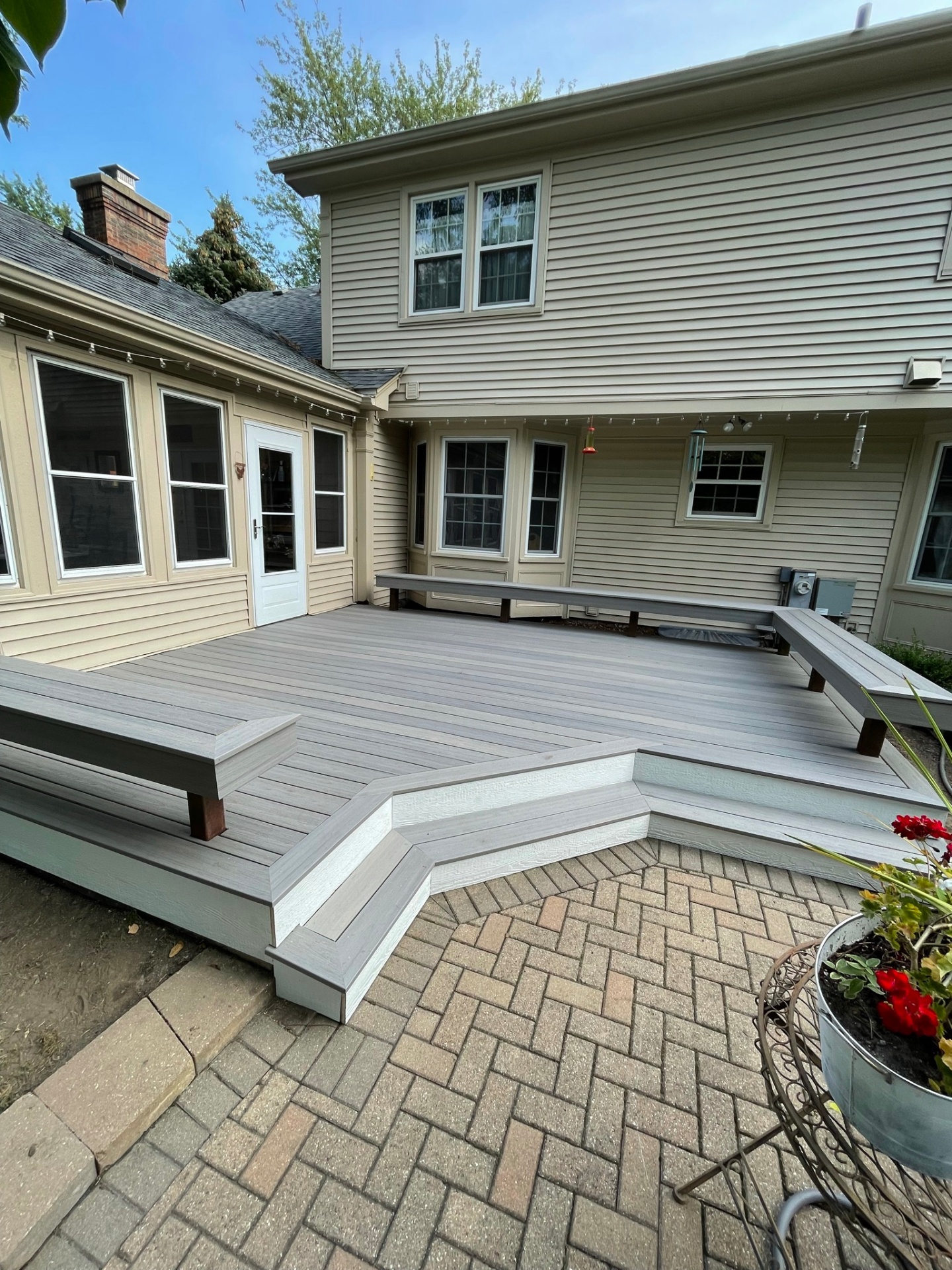 Custom backyard deck and outdoor living addition as part of a whole-home renovation project